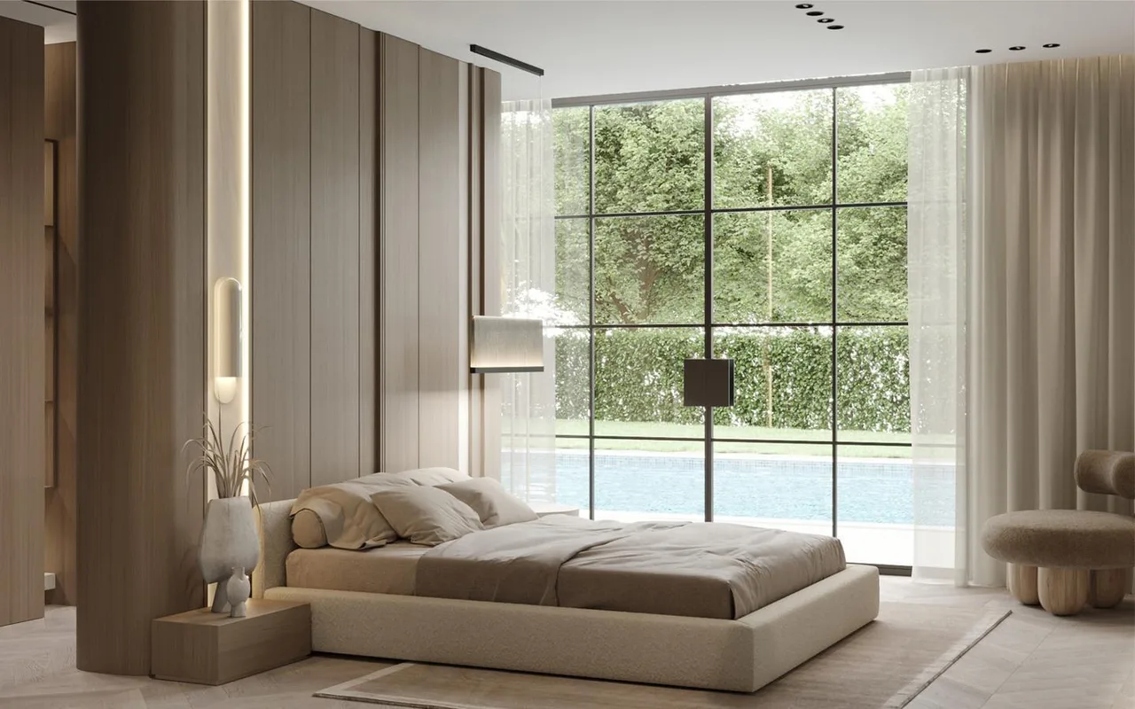 Modern villa bedroom at Dolce Resort Goa with floor-to-ceiling glass overlooking the pool and garden