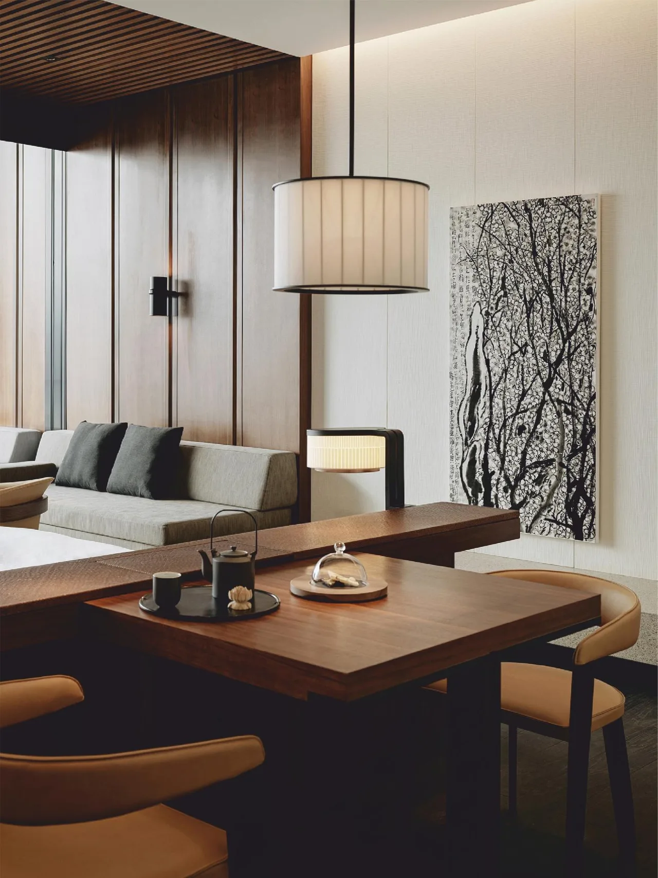 Living and dining interior at Dolce Resort Udaipur with warm wood panelling and designer furniture