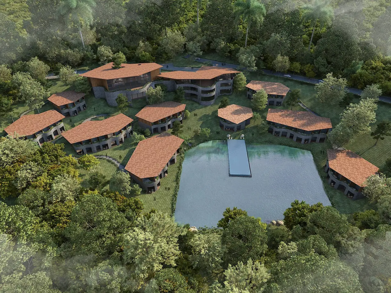 Aerial view of KAMAH Resort Coorg — 20-acre Wyndham wellness resort with villas around a natural infinity lake in the coffee-estate forest
