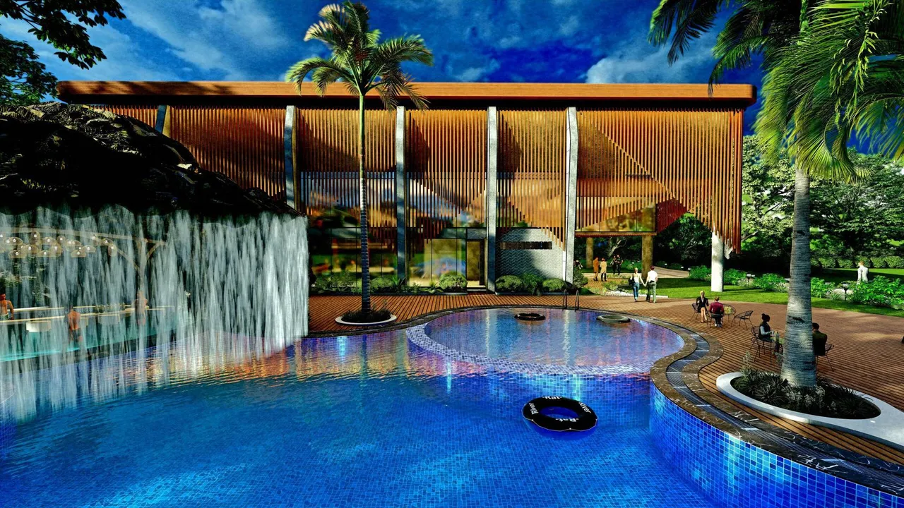 Clubhouse and free-form leisure pool with cascading waterfall at Regenta Resort & Spa Pushkar
